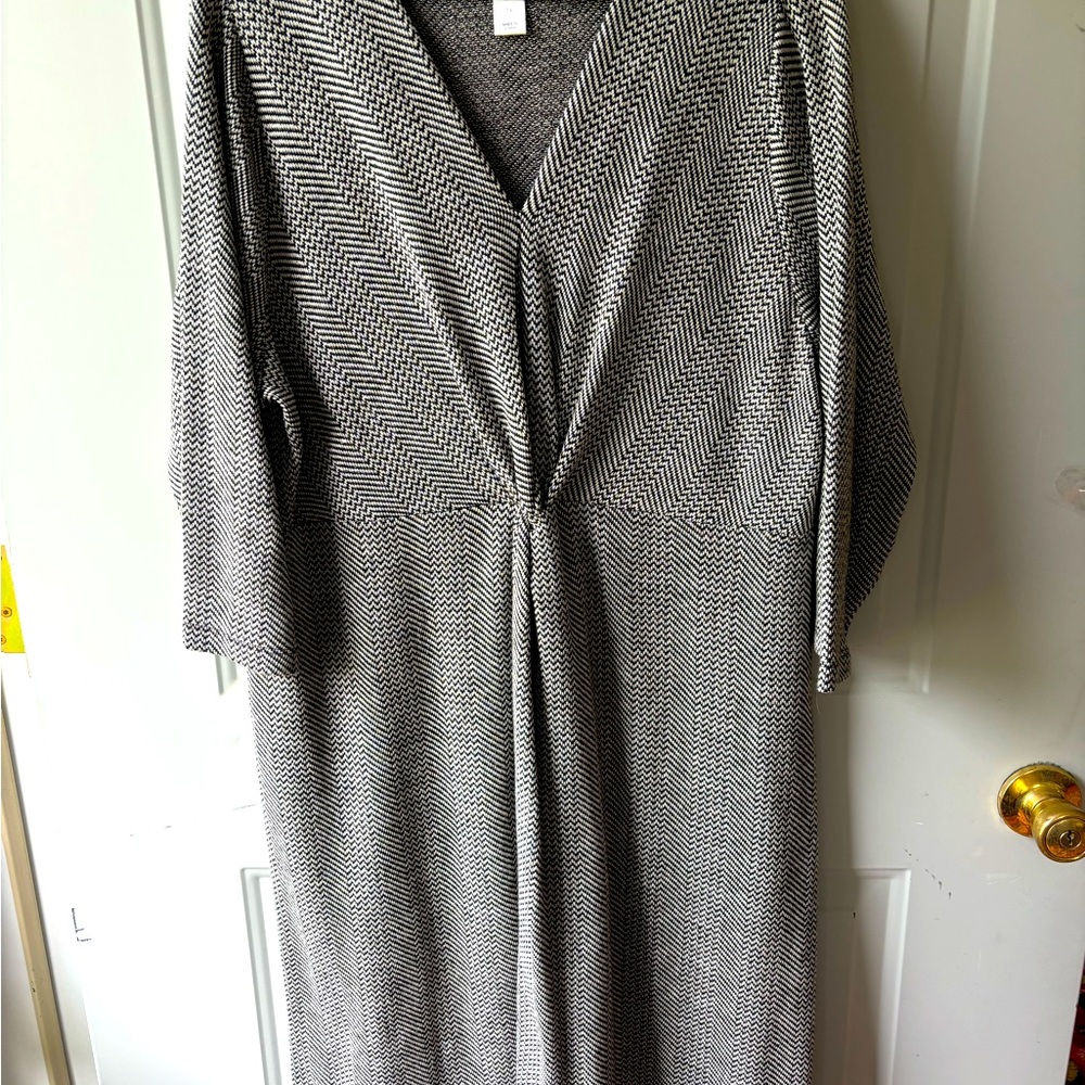 Twist-front career dress in black and white herringbone-like knit